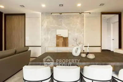 Modern dining area with elegant decor and stylish lighting in a contemporary home.