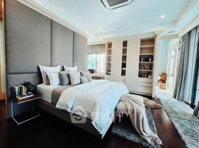 Luxurious modern bedroom with elegant decor and ample natural light