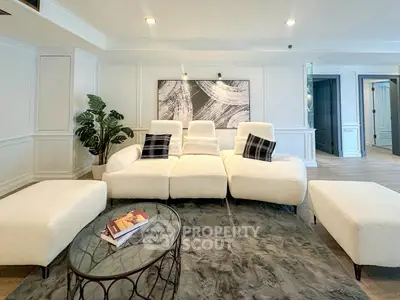 Luxurious modern living room with plush white sofas and elegant decor