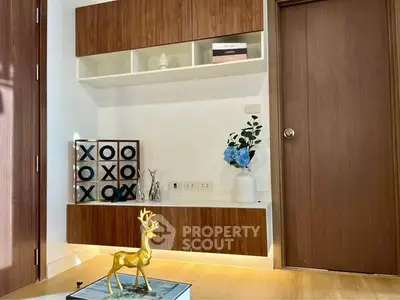 Modern interior with stylish wooden cabinets and decorative accents in a cozy living space.