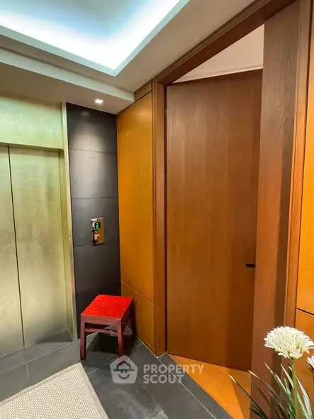 Luxurious elevator entrance with modern wood paneling and sleek design