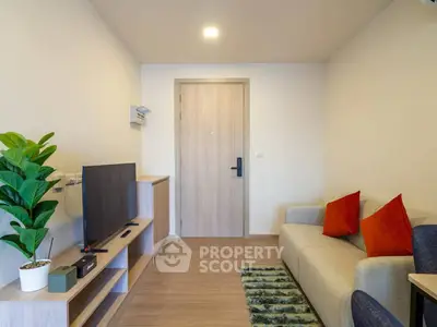 Modern living room with cozy sofa, TV unit, and stylish decor in a contemporary apartment.