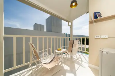 Charming balcony with modern seating and scenic view, perfect for relaxation and enjoying the outdoors.
