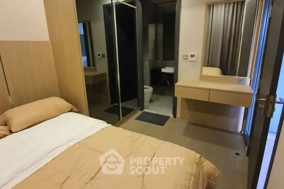 Cozy bedroom with ensuite bathroom and modern furnishings