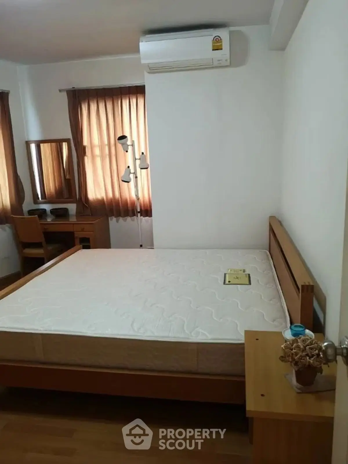 Cozy bedroom with wooden furniture and natural light