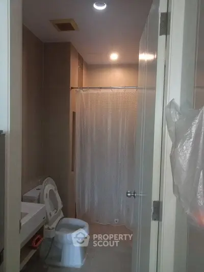 Cozy bathroom with modern fixtures and shower curtain