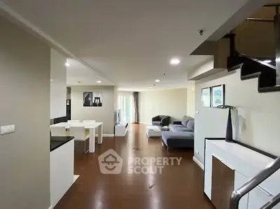 Spacious modern living room with sleek furniture and open layout