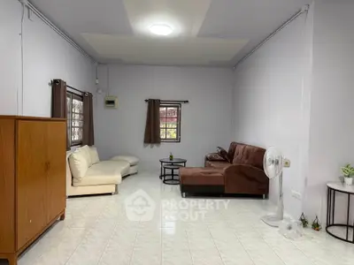 Spacious living room with modern furniture and natural light