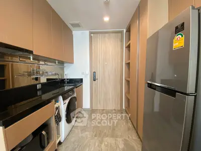 Modern kitchen with sleek appliances and ample storage space