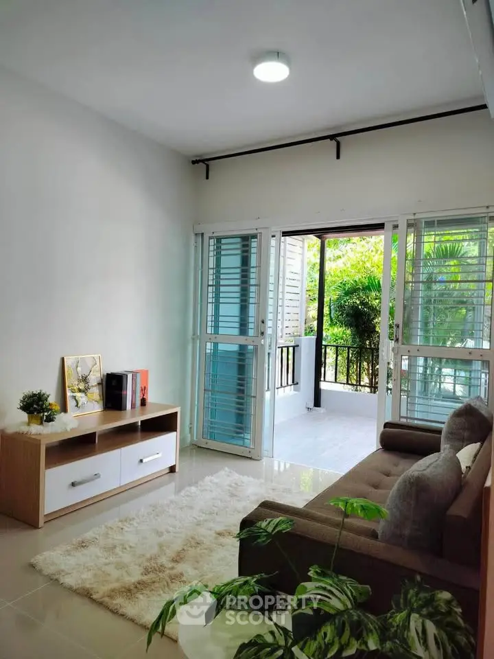 Bright living room with open balcony and modern decor