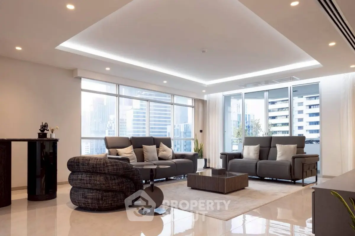 Luxurious modern living room with city view, sleek furniture, and elegant lighting.