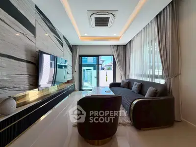 Luxurious modern living room with sleek design and large TV