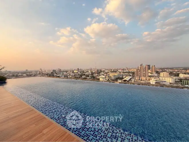 Stunning panoramic cityscape view with vibrant sky and expansive water body.