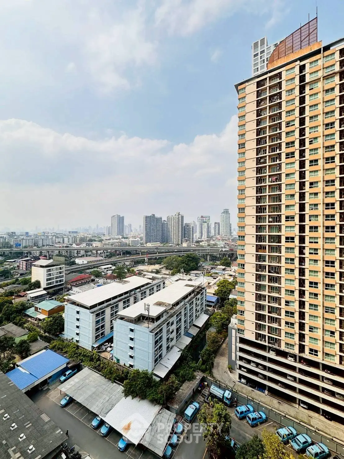 Stunning cityscape view from high-rise building balcony