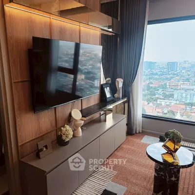 Luxurious living room with modern decor and stunning city view from large window.