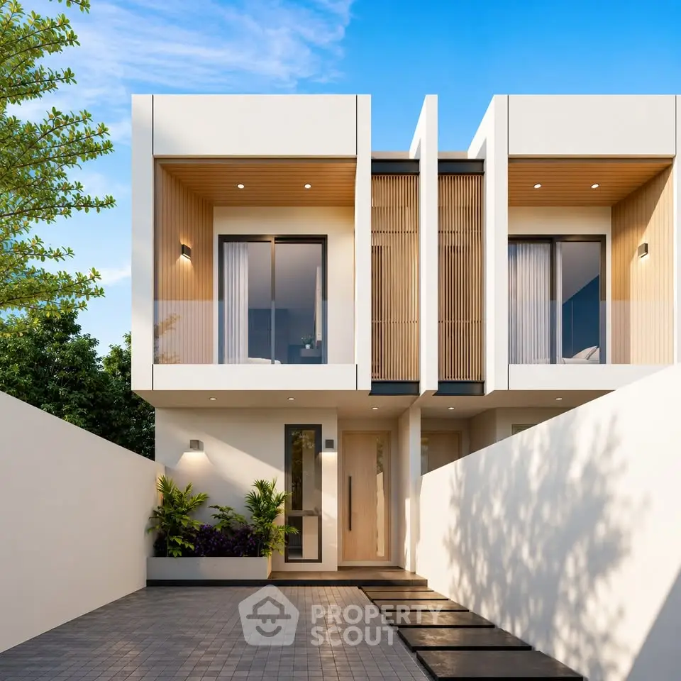 Modern minimalist townhouse with sleek facade and spacious driveway.
