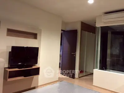 Modern living room with TV and air conditioning in stylish apartment