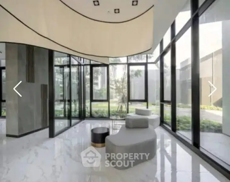 Luxurious modern building entrance with sleek design and large glass windows