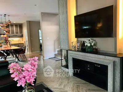 Elegant living room with modern decor and open kitchen layout