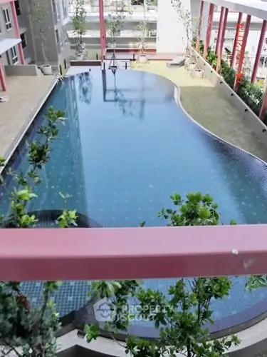 Luxurious rooftop pool with modern design and lush greenery in urban setting.