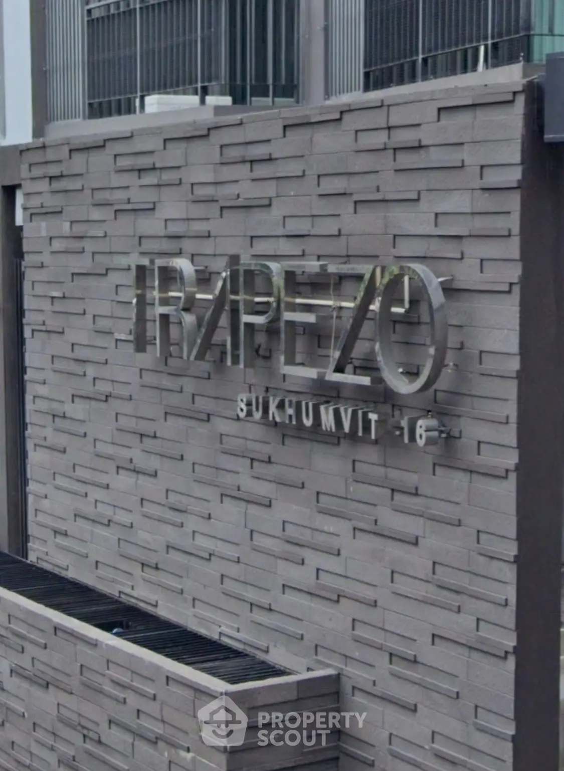 Modern building facade with stylish signage at Trapezo Sukhumvit 16