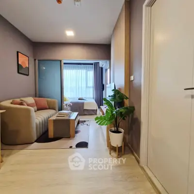 Modern apartment interior with cozy living room and bedroom, featuring stylish decor and natural light.