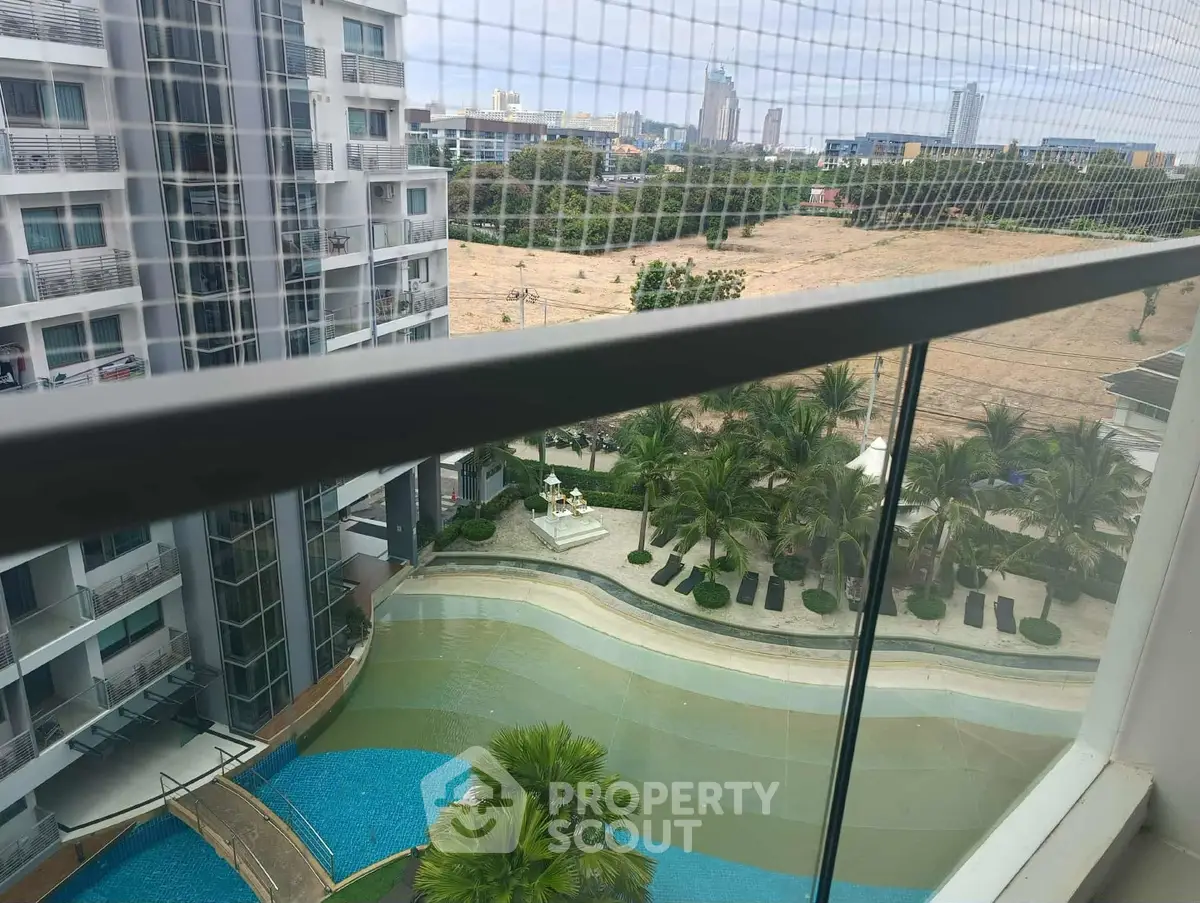 Stunning high-rise view with pool and cityscape in the background