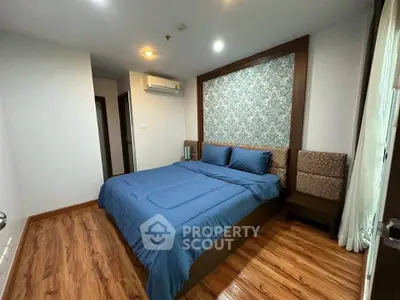 Cozy bedroom with elegant decor and wooden flooring