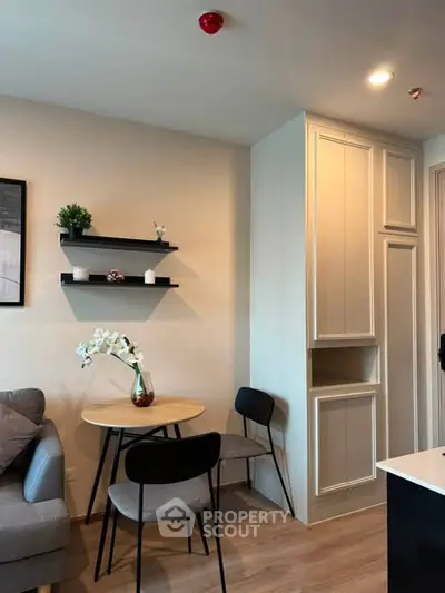 Modern living room with cozy dining area and stylish decor
