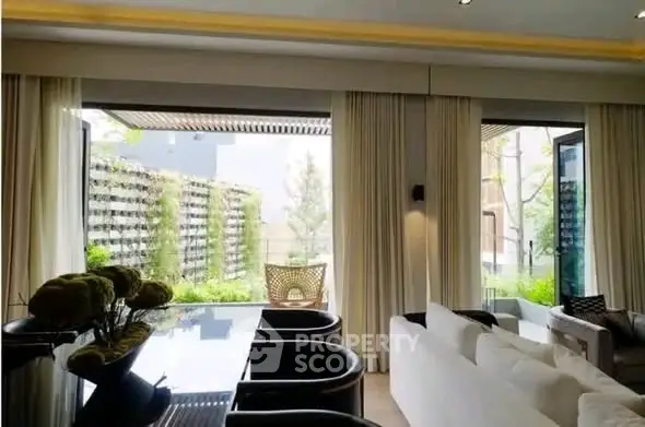 Luxurious living room with garden view and elegant decor