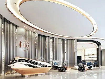 Luxurious modern lobby with sleek design and elegant decor, featuring a striking reception desk and stylish seating area.