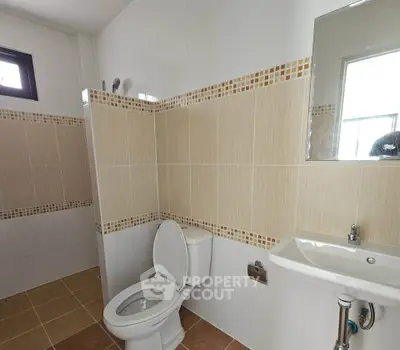 Spacious bathroom with modern fixtures and stylish tile design