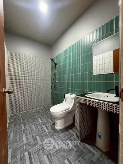 Modern bathroom with stylish tile design and contemporary fixtures.