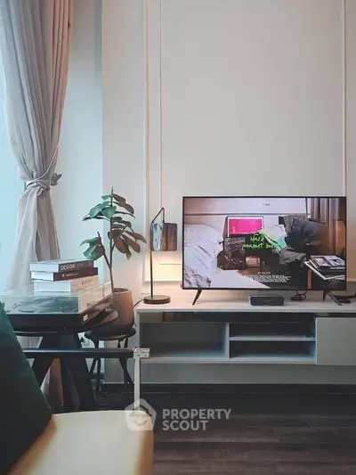 Modern living room with stylish decor and flat-screen TV