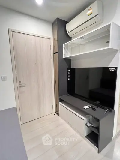 Modern living room with sleek furniture and air conditioning