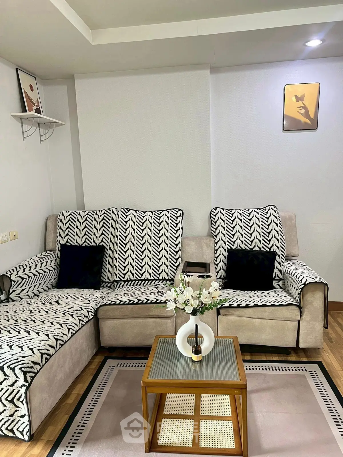 Stylish living room with patterned sofa and elegant decor