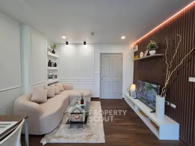 Modern living room with stylish decor, cozy seating, and ambient lighting for a welcoming atmosphere.