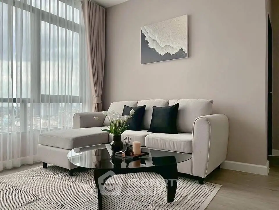 Modern living room with elegant sofa and chic decor in a bright apartment.