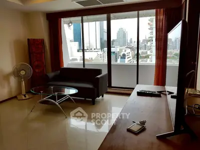 Modern living room with city view, sleek furniture, and natural light.