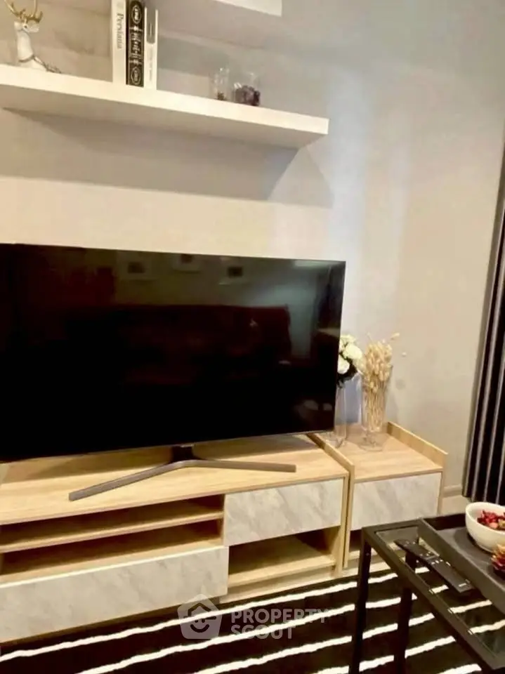 Modern living room with sleek TV stand and decorative shelves