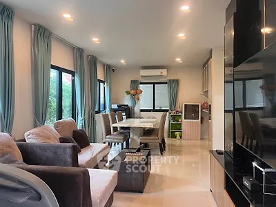 Spacious modern living room with elegant dining area and large windows