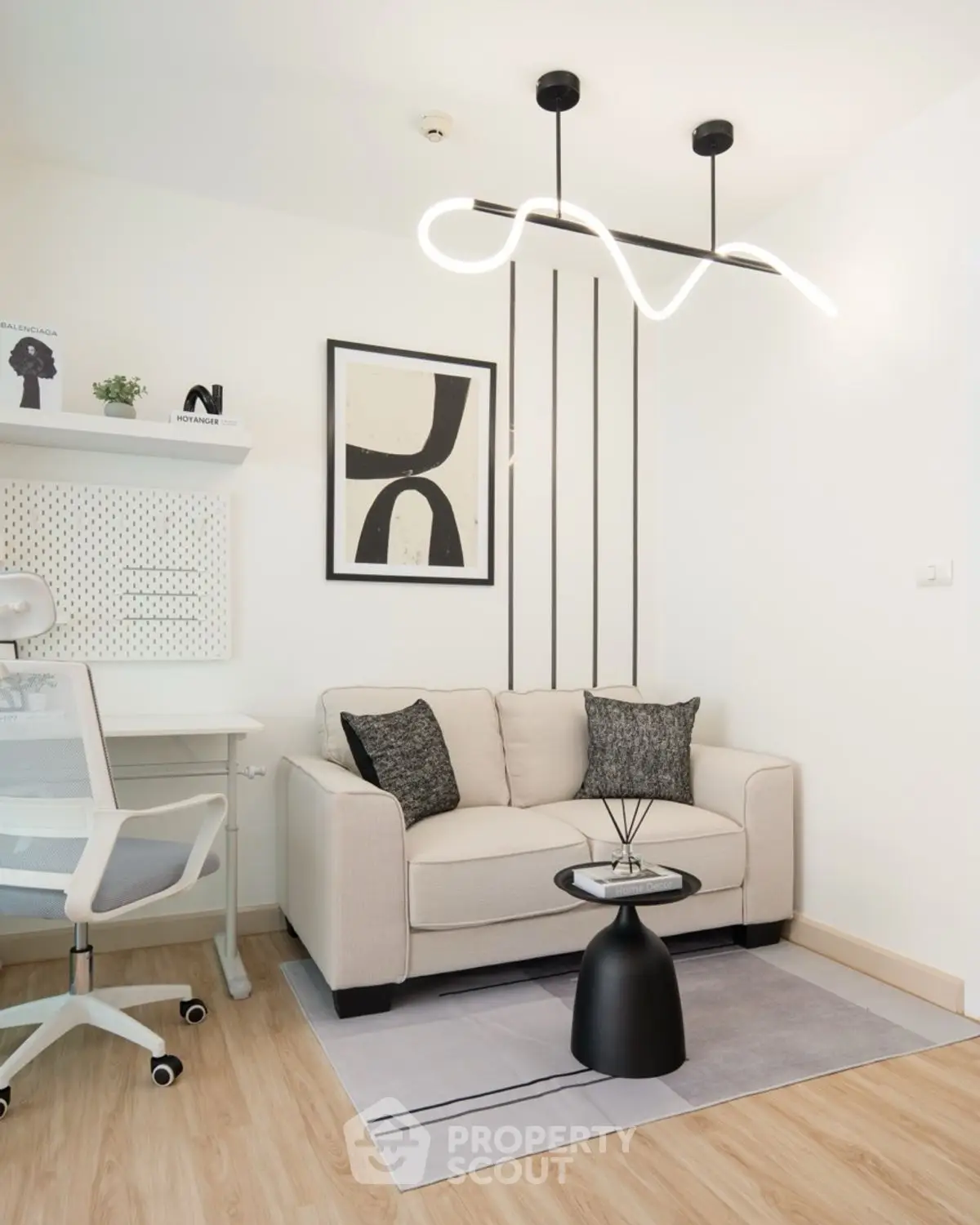 Modern study room with stylish lighting and cozy seating area