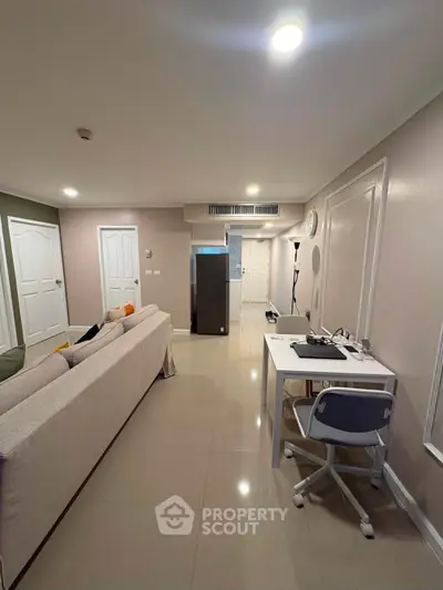 Modern living room with sleek furniture and open layout, perfect for urban living.