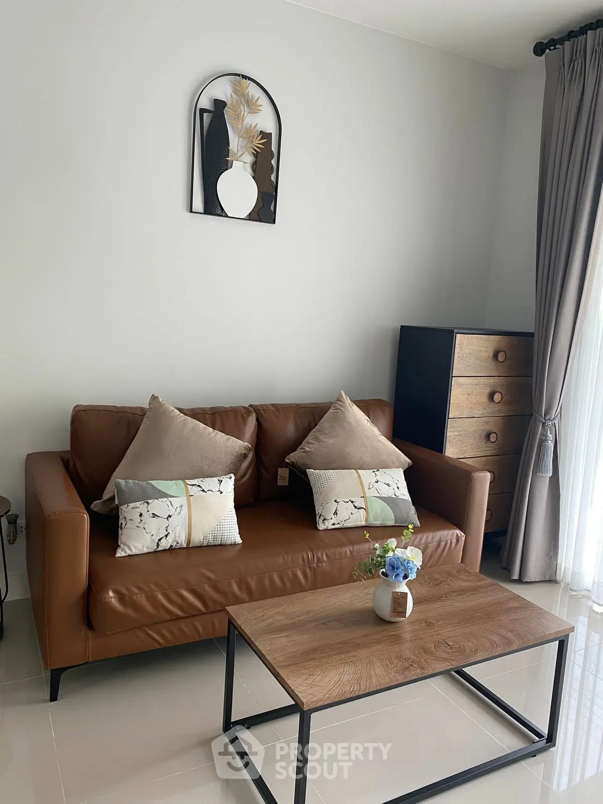 Stylish living room with modern leather sofa and chic decor