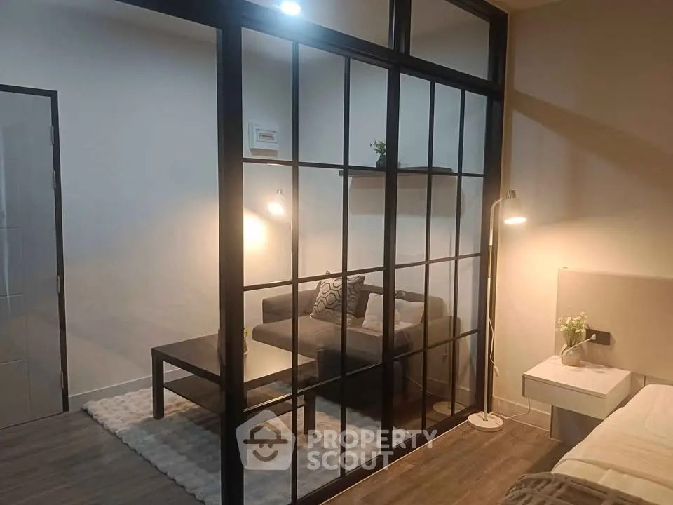 Modern living room with glass partition and cozy decor