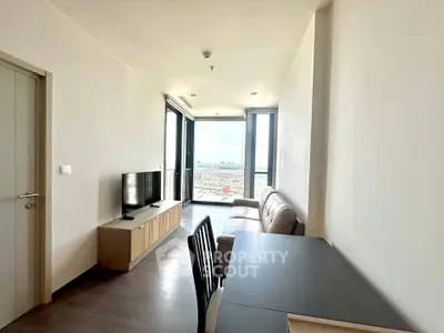 Modern living room with sleek furniture and panoramic city view