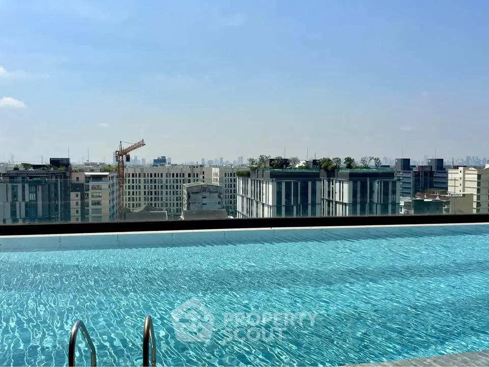 Stunning rooftop pool with panoramic city skyline view