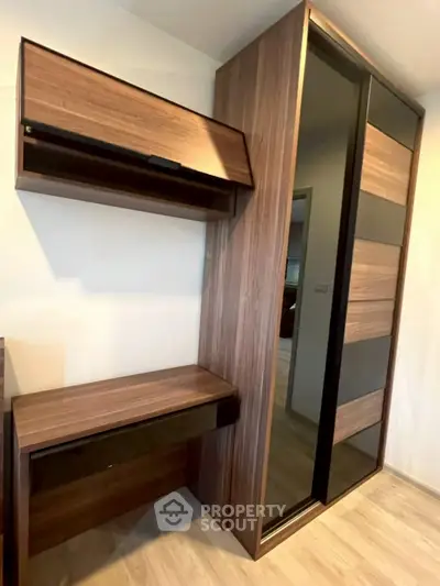 Modern wooden wardrobe with sleek design and ample storage space in a stylish interior.
