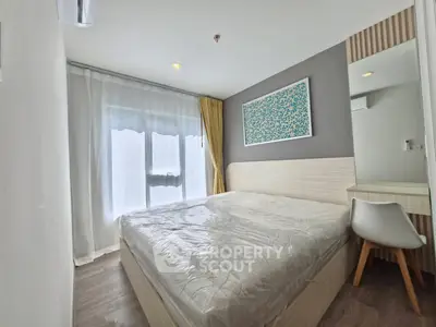 Modern bedroom with large window and stylish decor