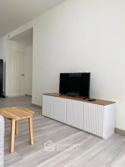 Modern living room with sleek TV stand and minimalist decor